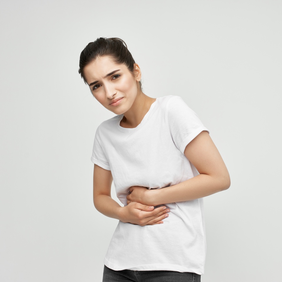 heaviness in the stomach woman feeling uncomfortable