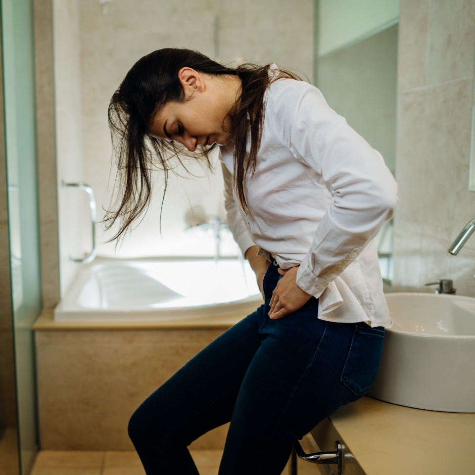 Woman having severe abdominal menstrual pain.Gastrointestinal autoimmune disease.Dysmenorrhea/endometriosis.Gastrointestinal problem.Constipation/diarrhea.Feminine health care.Painful period