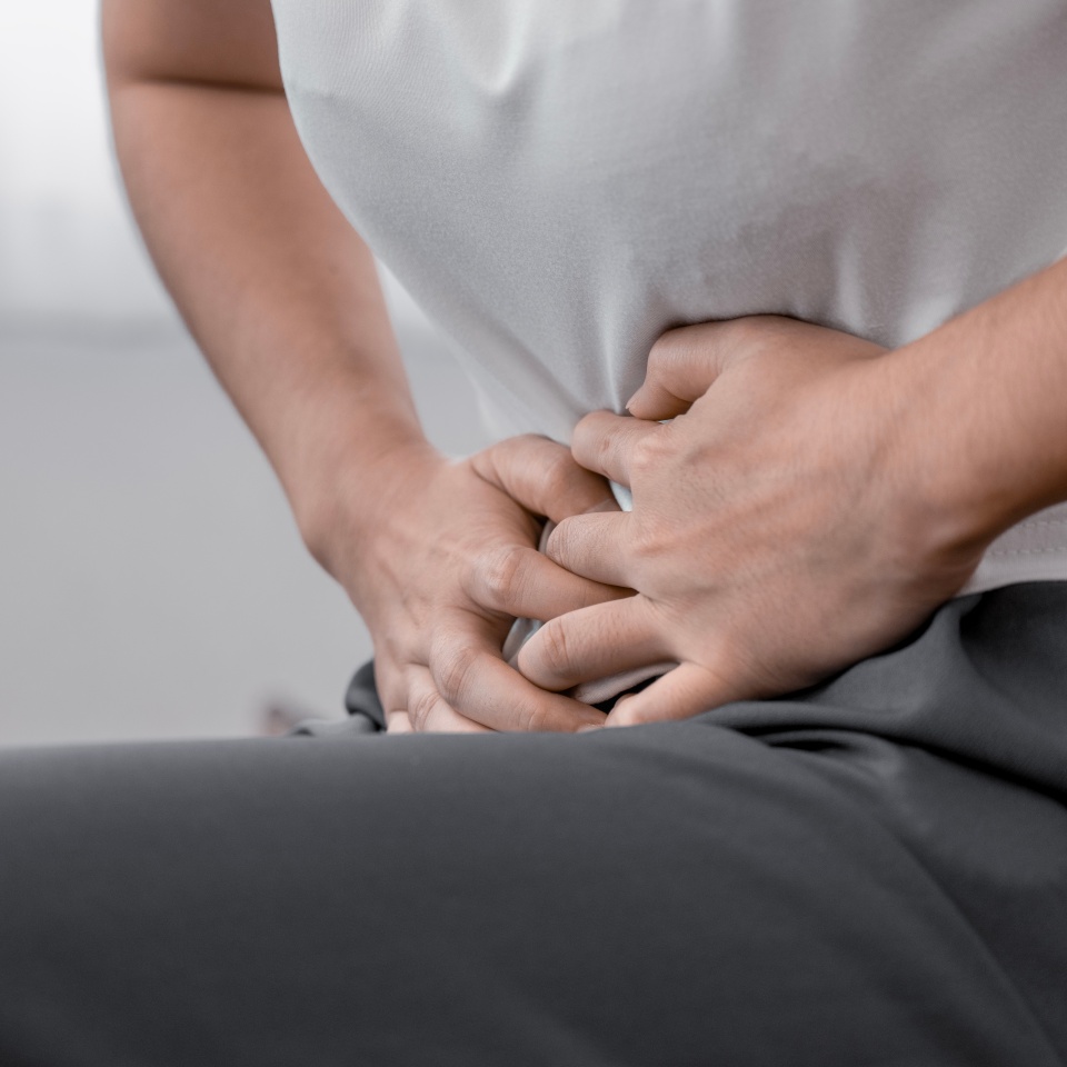 young woman hands in belly, stomach pain from food poisoning, abdominal pain and digestive problem, gastritis or diarrhoea. Abdomen inflammation, menstrual period people.