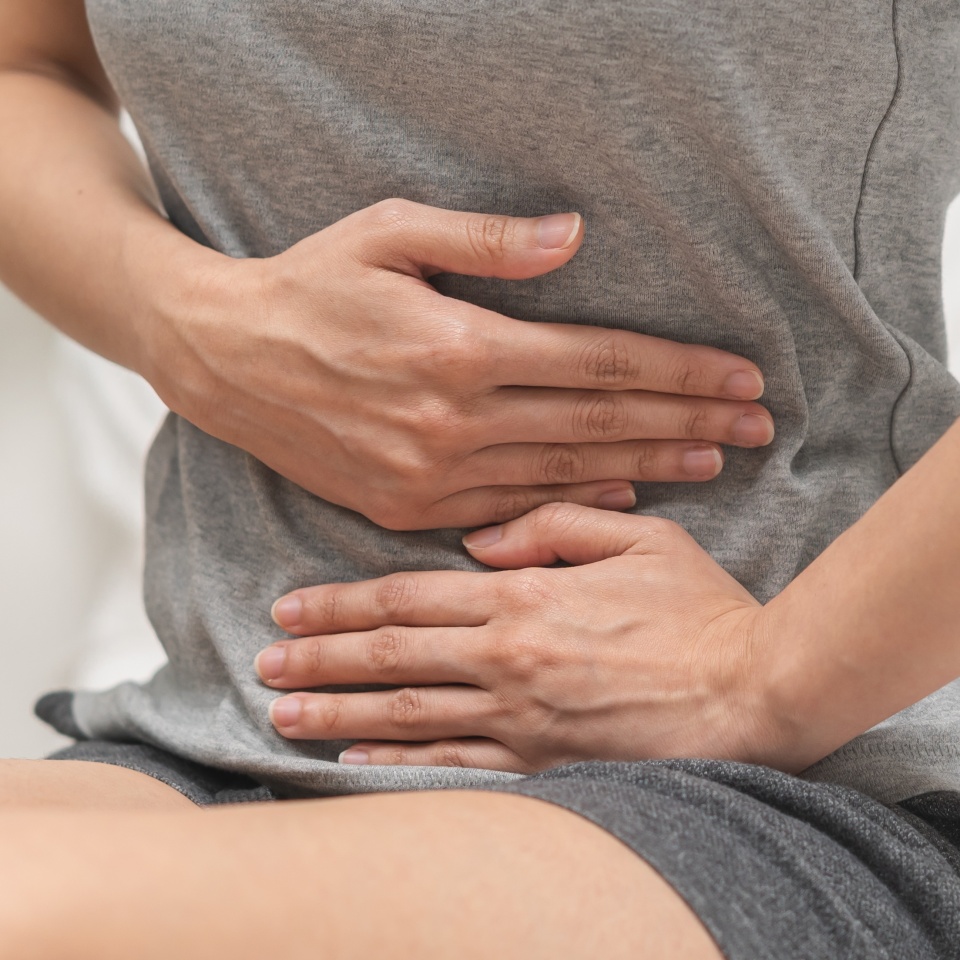 Flatulence ulcer, suffering ache young woman hand holding belly, stomach pain from food poisoning, abdominal digestive problem, gastritis or diarrhea. Abdomen inflammation, menstrual period people.
