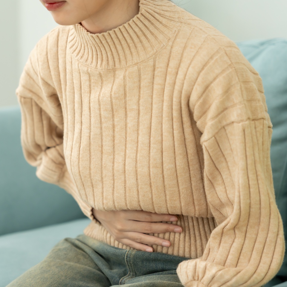stomach ache. Asian women have abdominal pain, indigestion, gastritis, menstrual cramps, flatulence, diarrhea, distention, colon cancer, belly inflammation problem, suffer food poisoning, abdomen