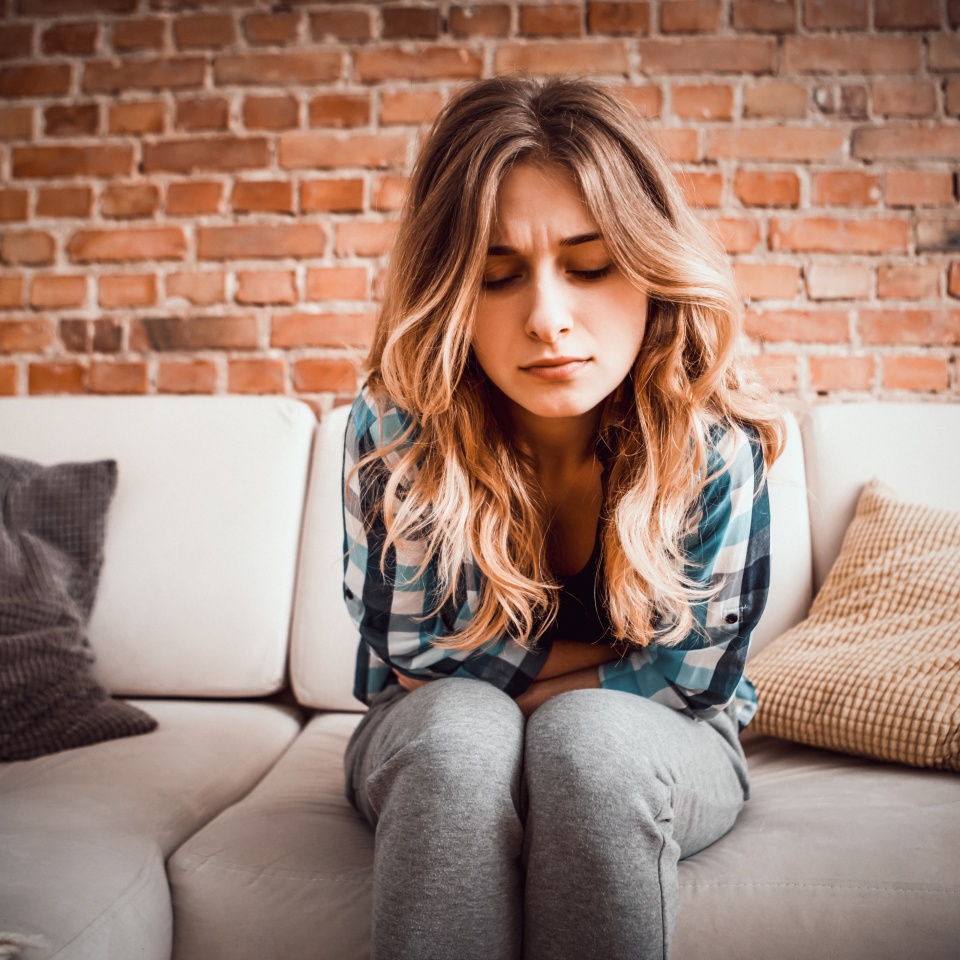 Stomach ache, women heaving menstruation pain problems.